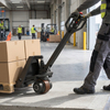 Electric pallet truck with powerful dual-motor drive units and a wireless remote control handle